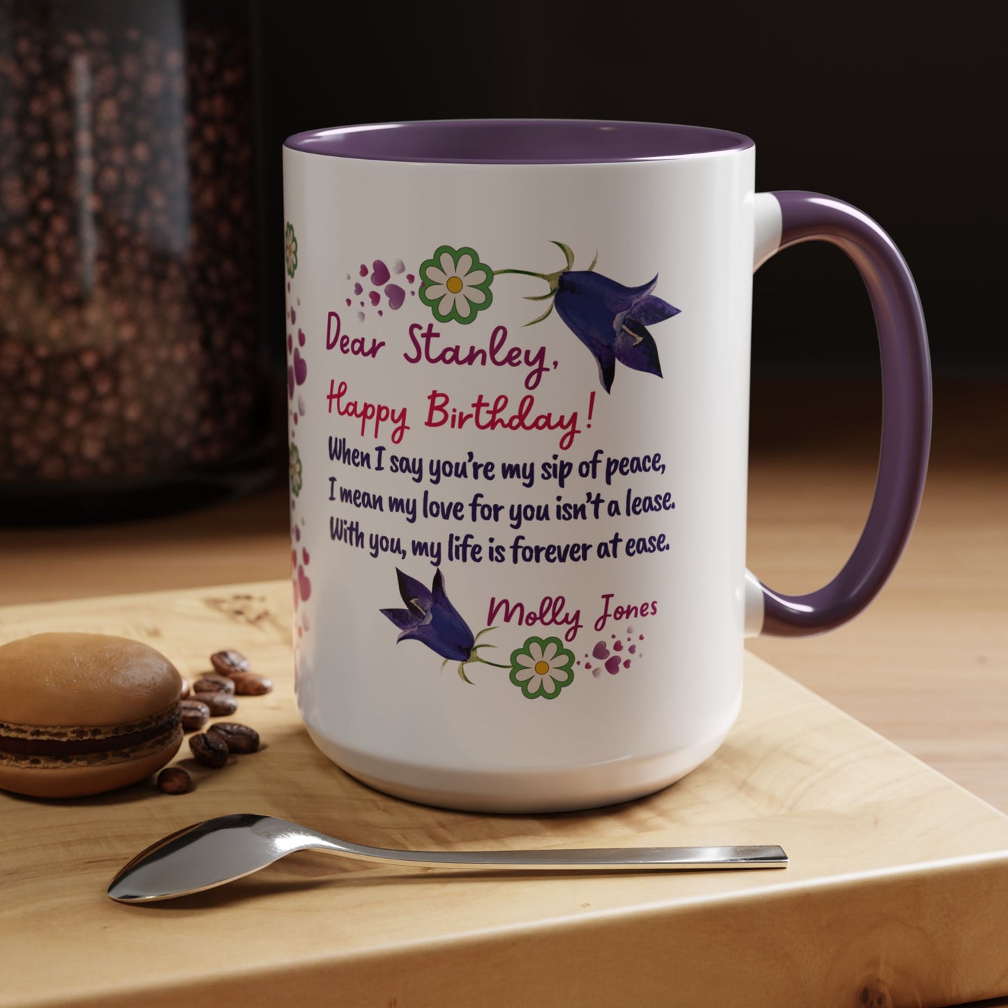 Personalized Birthday Mug for Husbands. White mug with purple interior and handle, featuring a personalized birthday message on a wooden surface with coffee beans and a macaron.