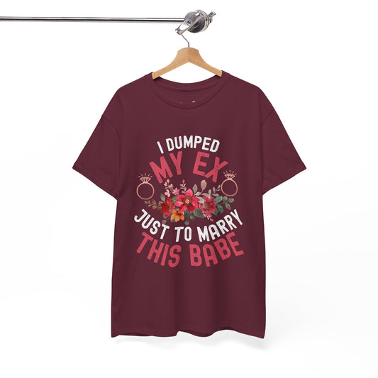 Maroon t-shirt with humorous text design on a hanger against a white background