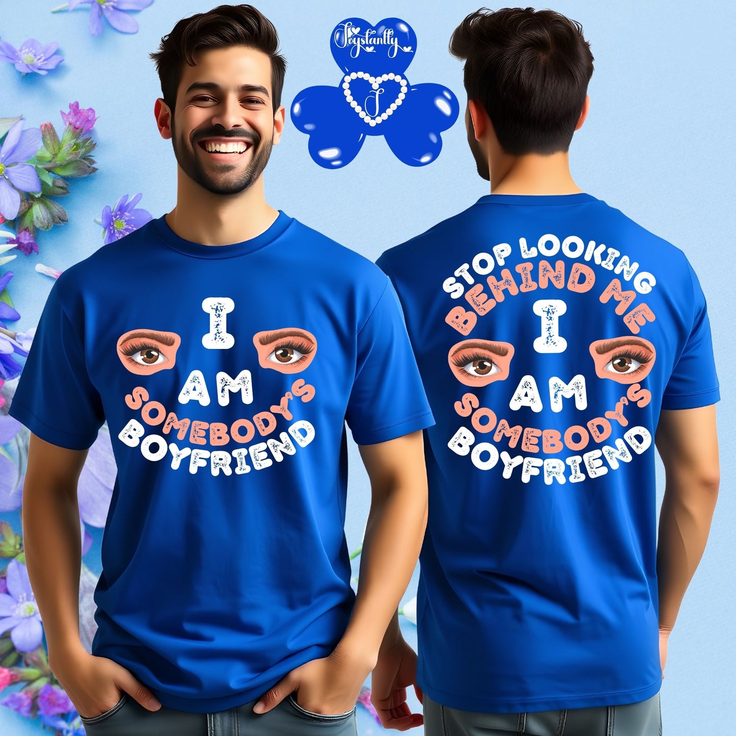Person wearing a blue t-shirt with text and eye illustrations, standing in front of a colorful floral background.