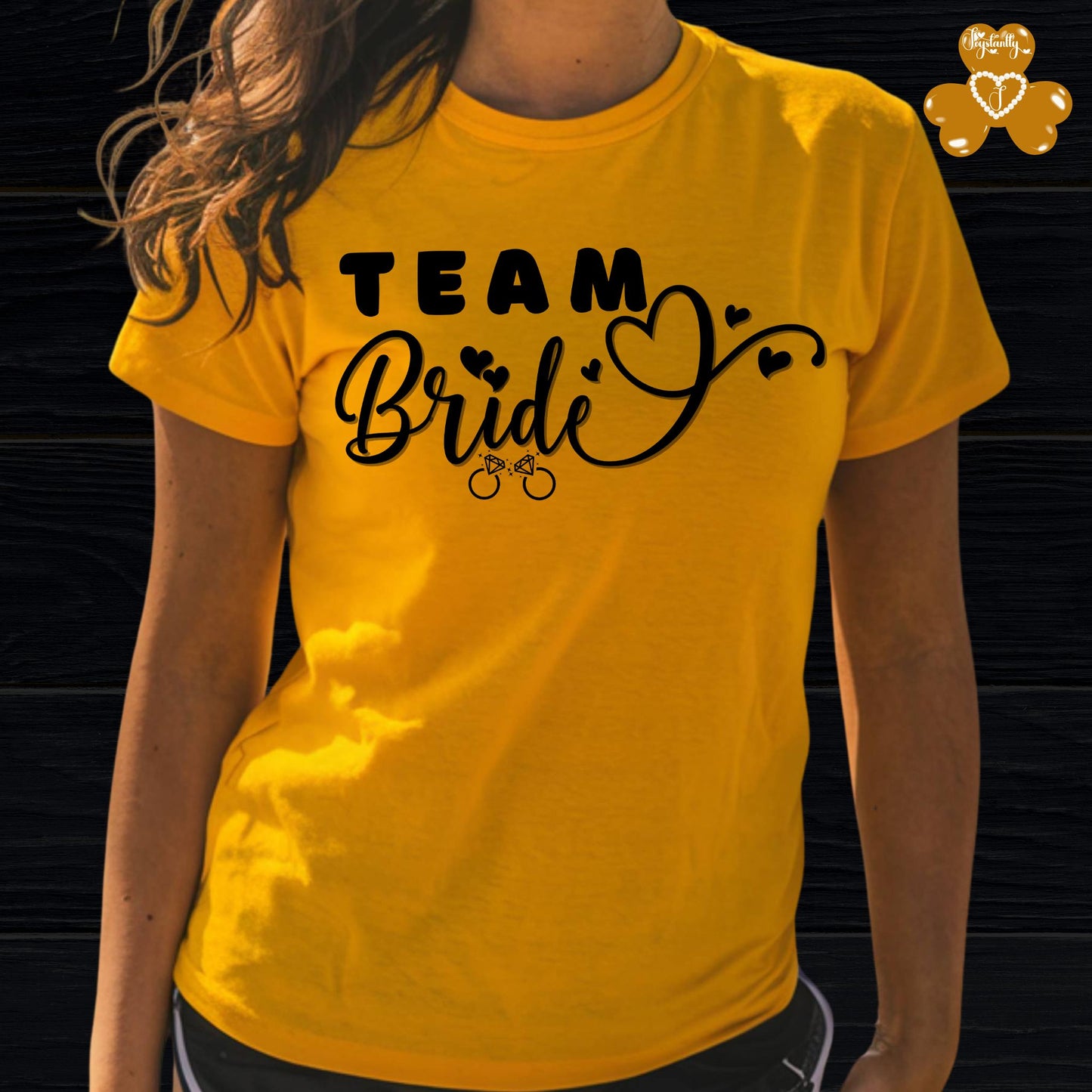 Shirt for Engagements, Bachelorettes, Hen and Bridal Parties. Yellow t-shirt with 'Team Bride' text on a black background