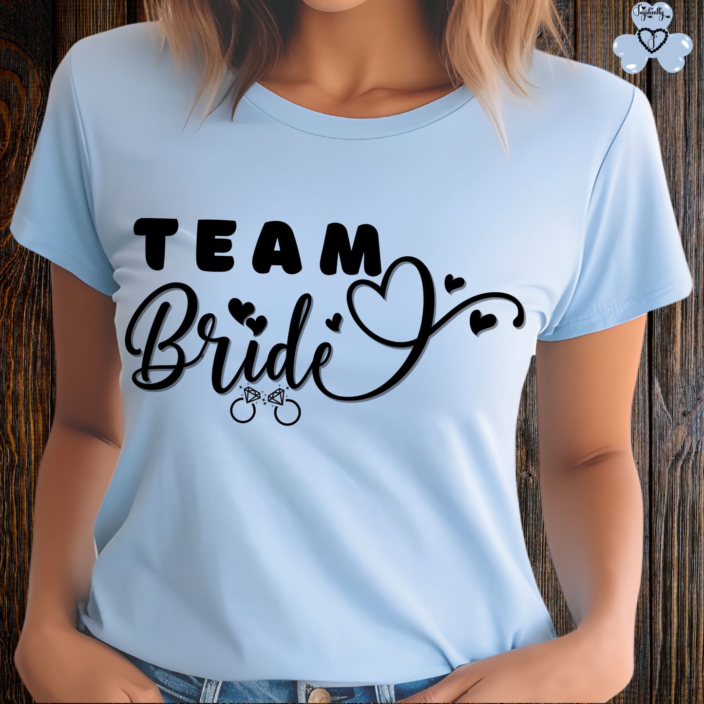 Shirt for Engagements, Bachelorettes, Hen and Bridal Parties. Light blue t-shirt with 'Team Bride' text on a wooden background