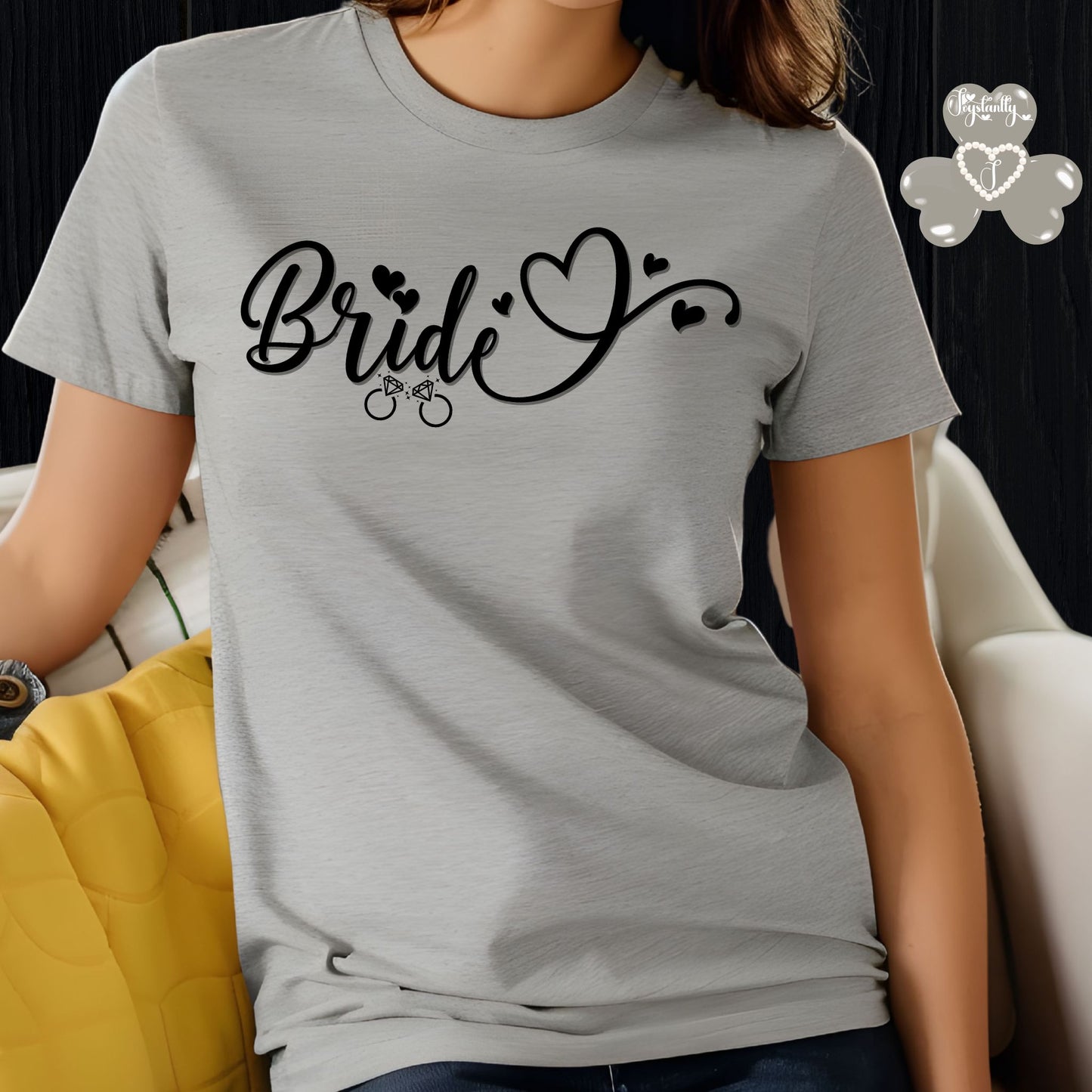 Super Shirt for Engagements, Bachelorettes, Hen and Bridal Parties. Person wearing a gray t-shirt with 'Bride' text and heart designs.