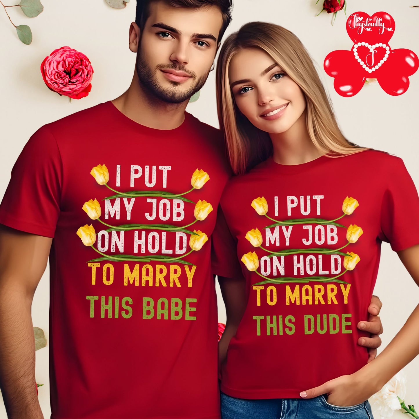 Two people wearing matching red t-shirts with humorous text, standing close together.