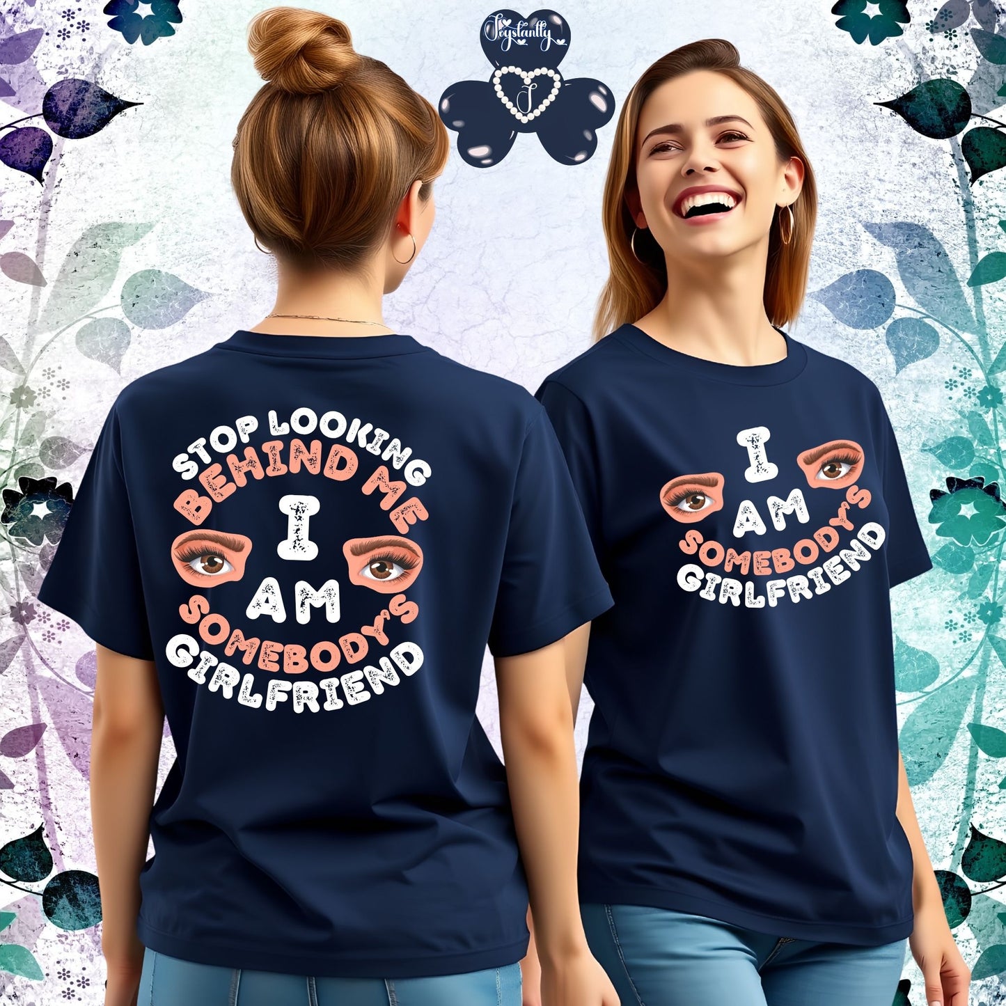 Two women wearing navy blue t-shirts with a colorful design and text.
