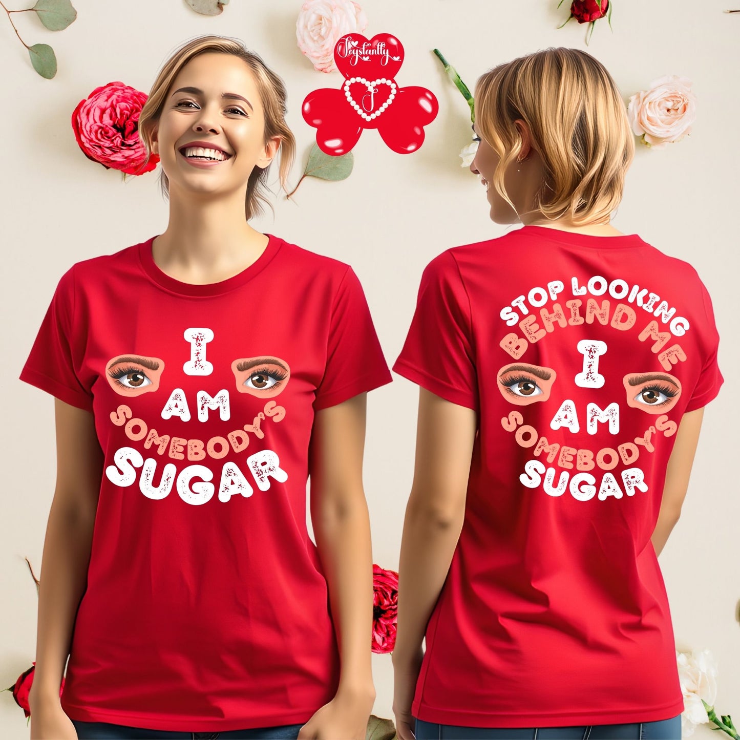 Red t-shirt with text and eye design worn by a person, with a floral background.