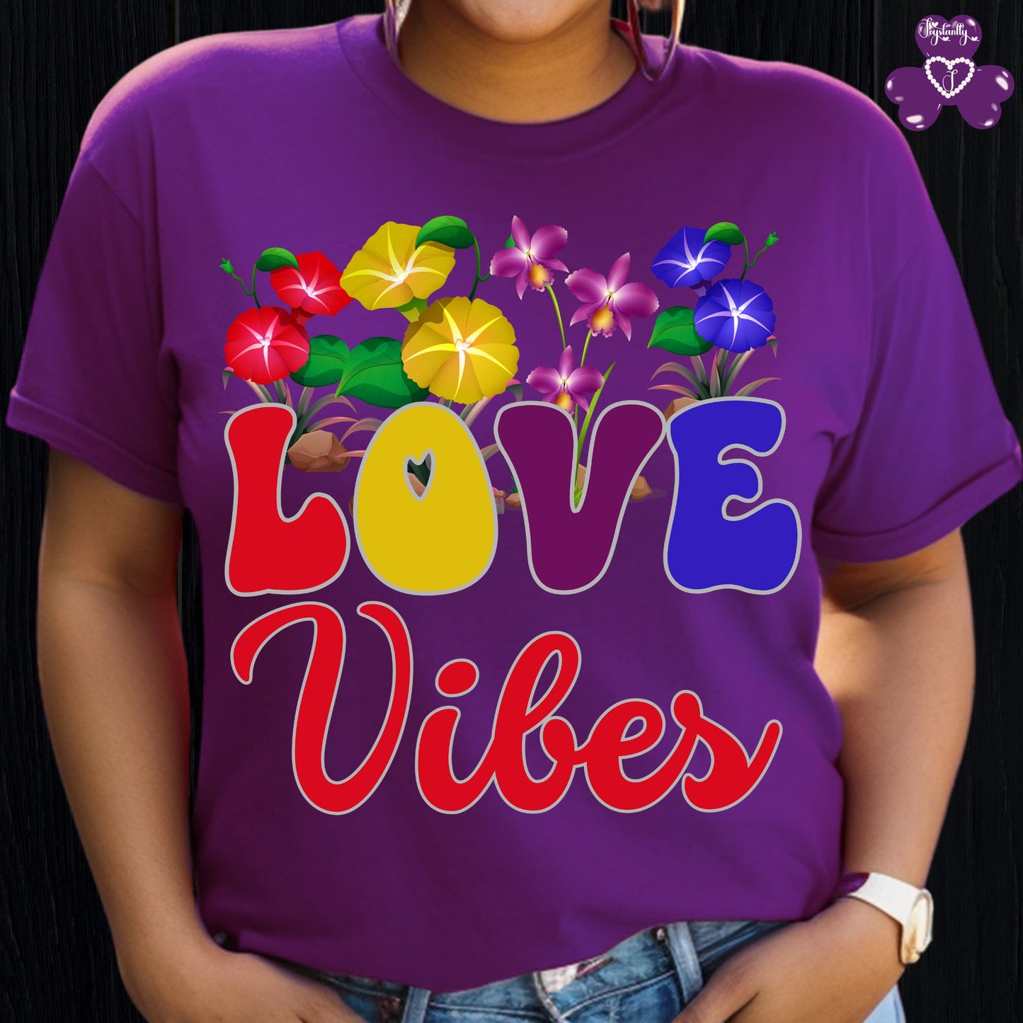 Motivational T-shirt for positive affirmations. Purple t-shirt with 'LOVE Vibes' design featuring colorful flowers on a black background.