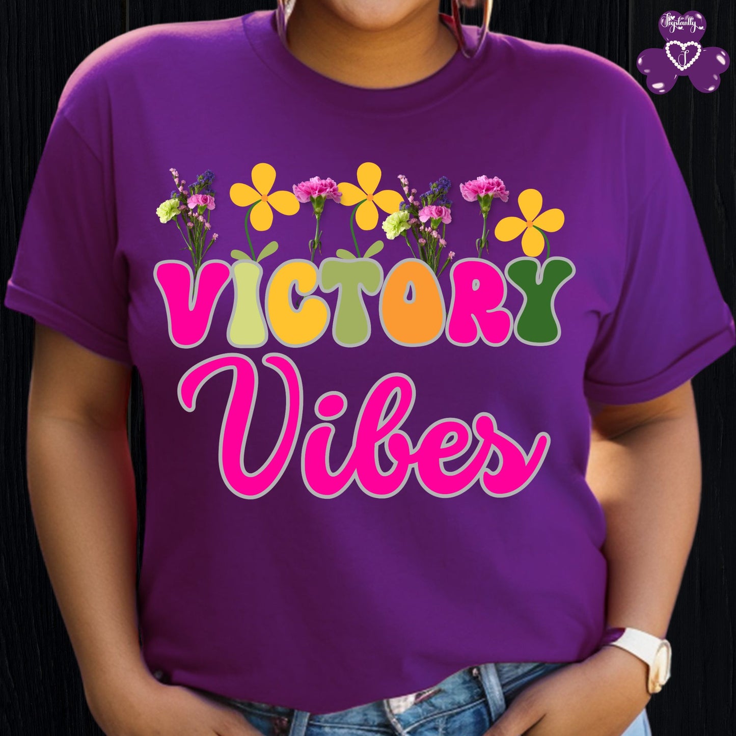 Motivational T-shirt for positive affirmations. Purple t-shirt with 'Victory Vibes' and floral designs on a black background