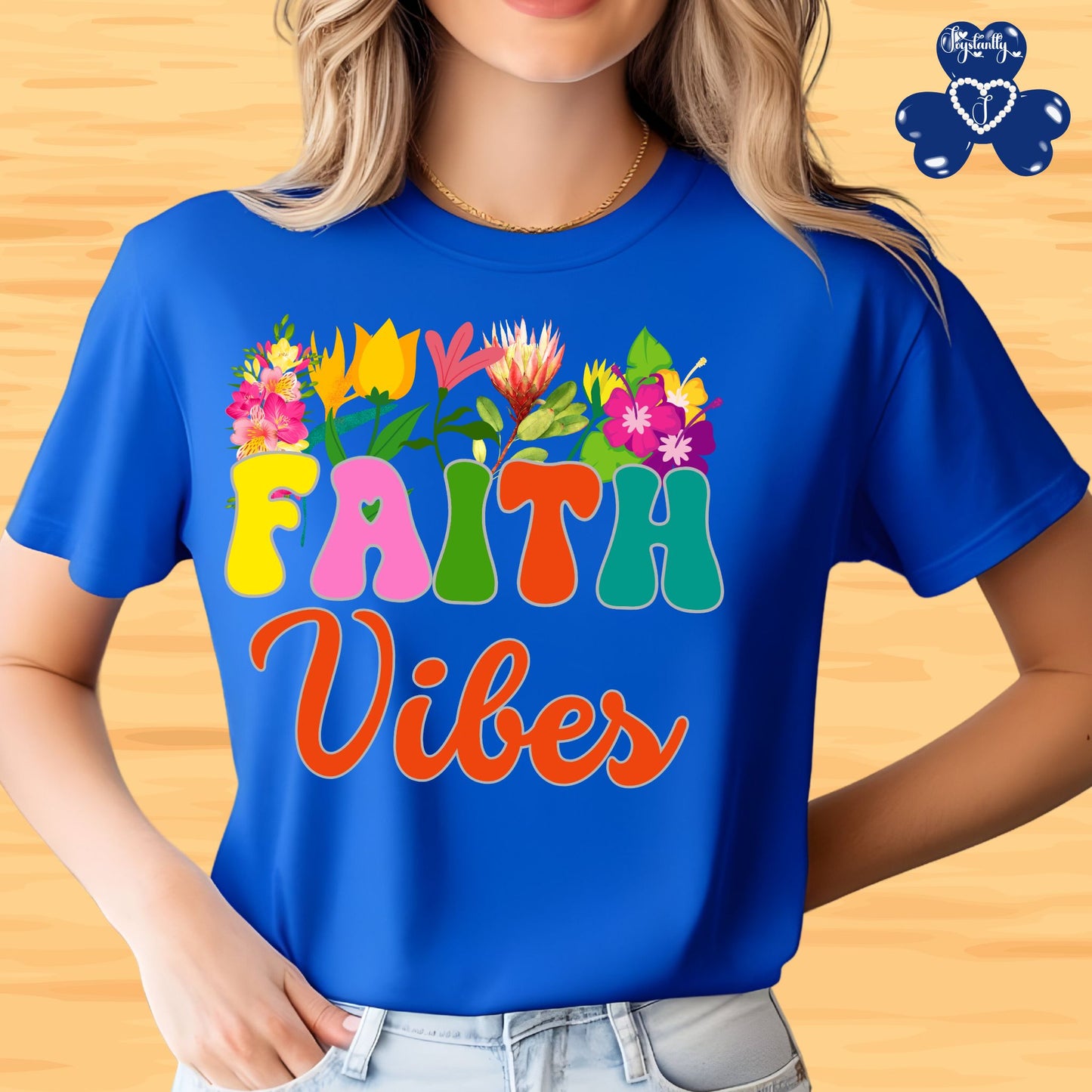 Motivational Shirts for Positive Affirmations. Person wearing a blue t-shirt with colorful 'FAITH Vibes' text and floral designs.