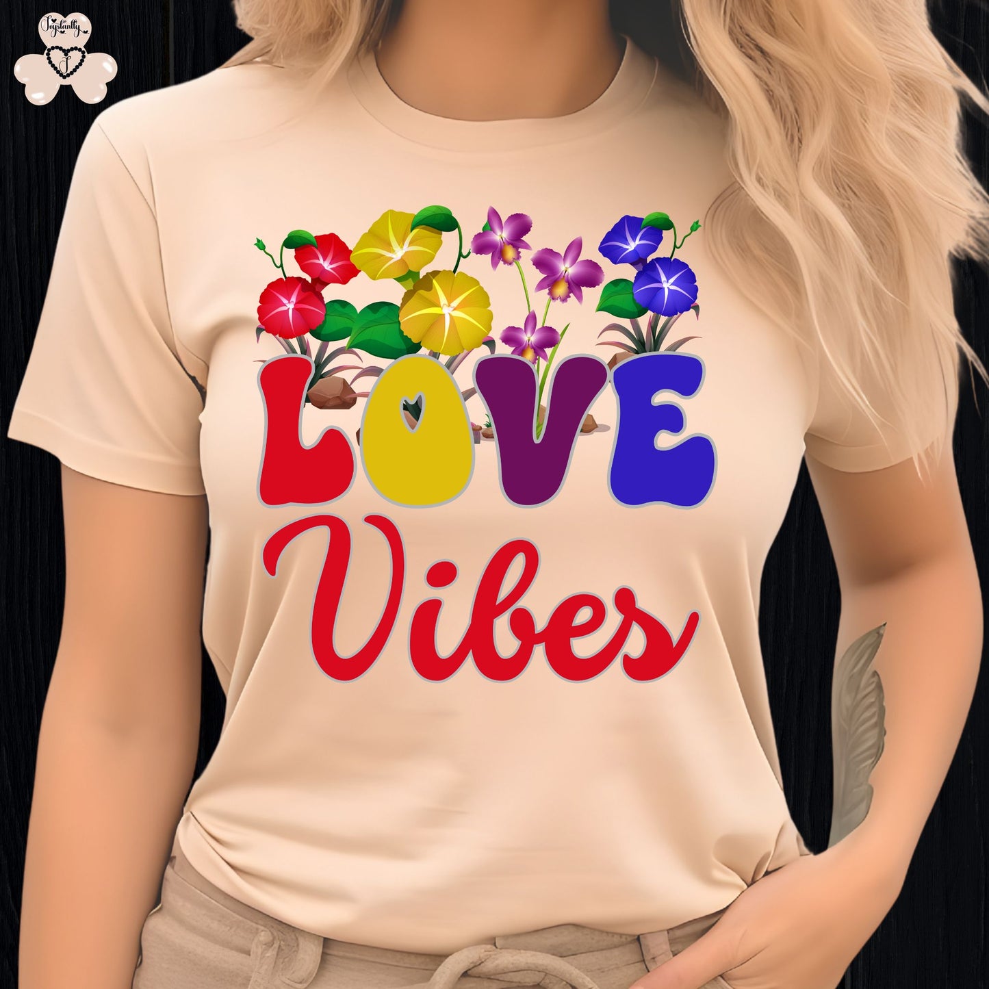 Motivational T-shirt for positive affirmations. Beige t-shirt with colorful 'LOVE Vibes' design on a black background