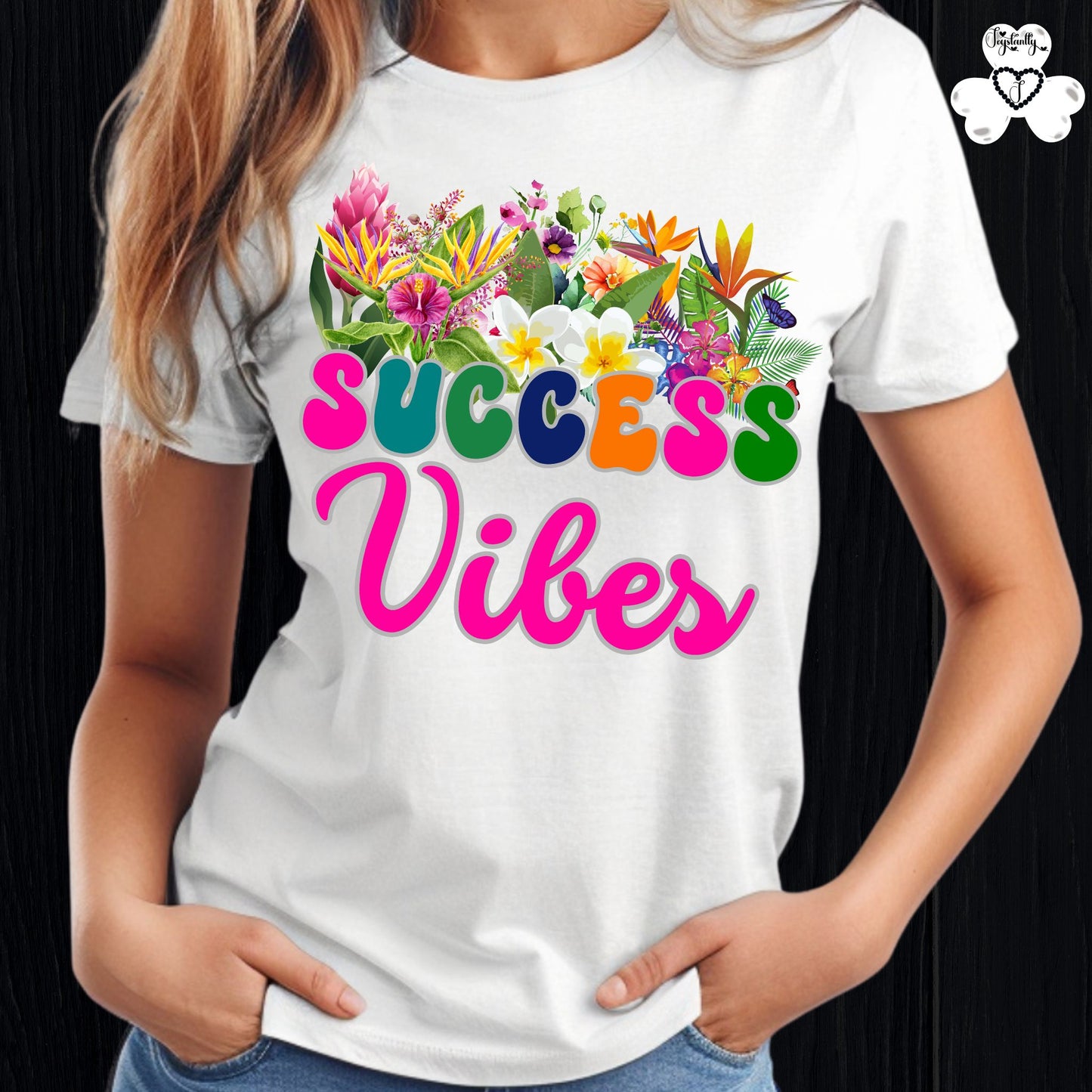 Motivational T-shirt for positive affirmations. White t-shirt with colorful floral design and 'SUCCESS Vibes' text on a black background