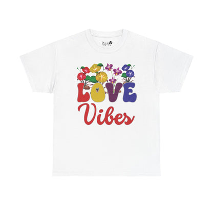 White t-shirt with 'Love Vibes' text and colorful floral design on a white background