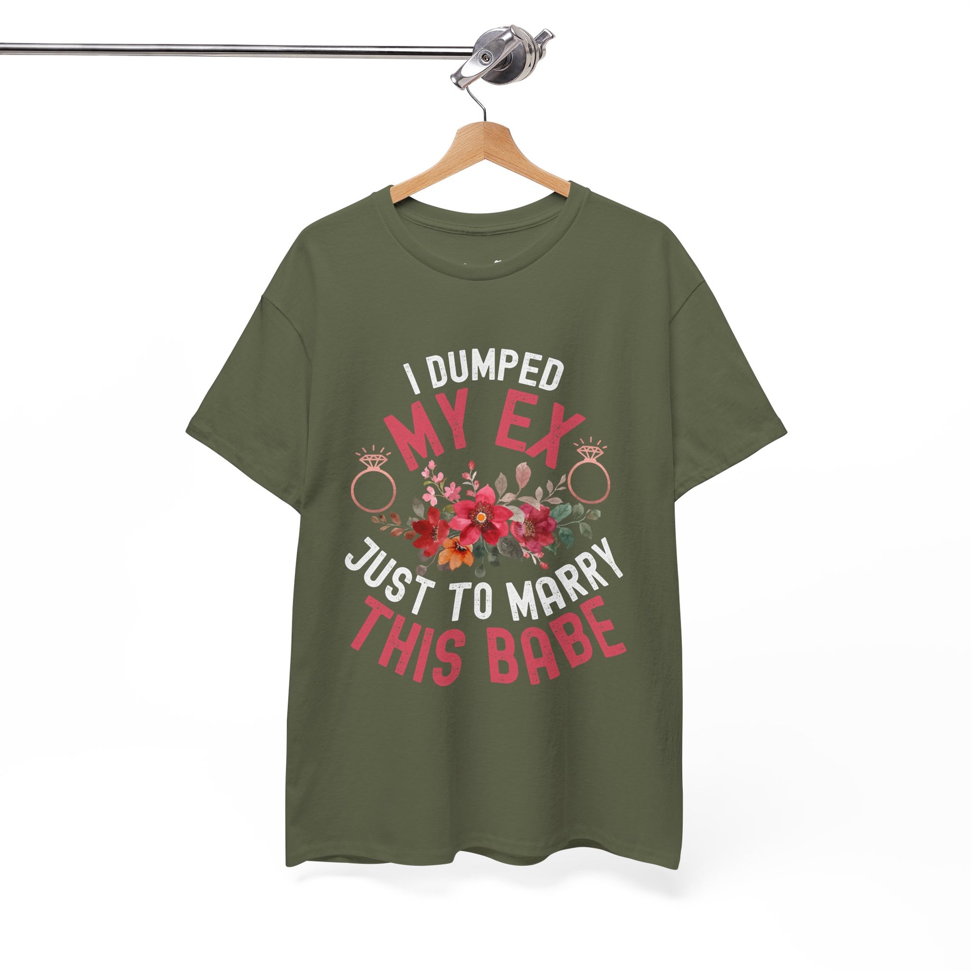 Green t-shirt with humorous text and floral design on a hanger against a white background