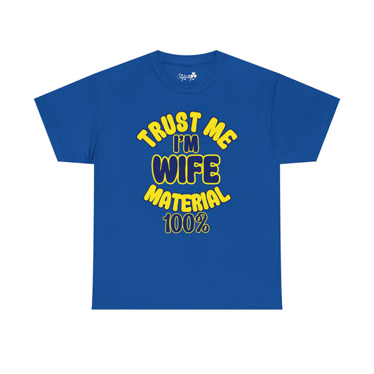 Blue t-shirt with yellow text 'TRUST ME I'M WIFE MATERIAL 100%' on a white background