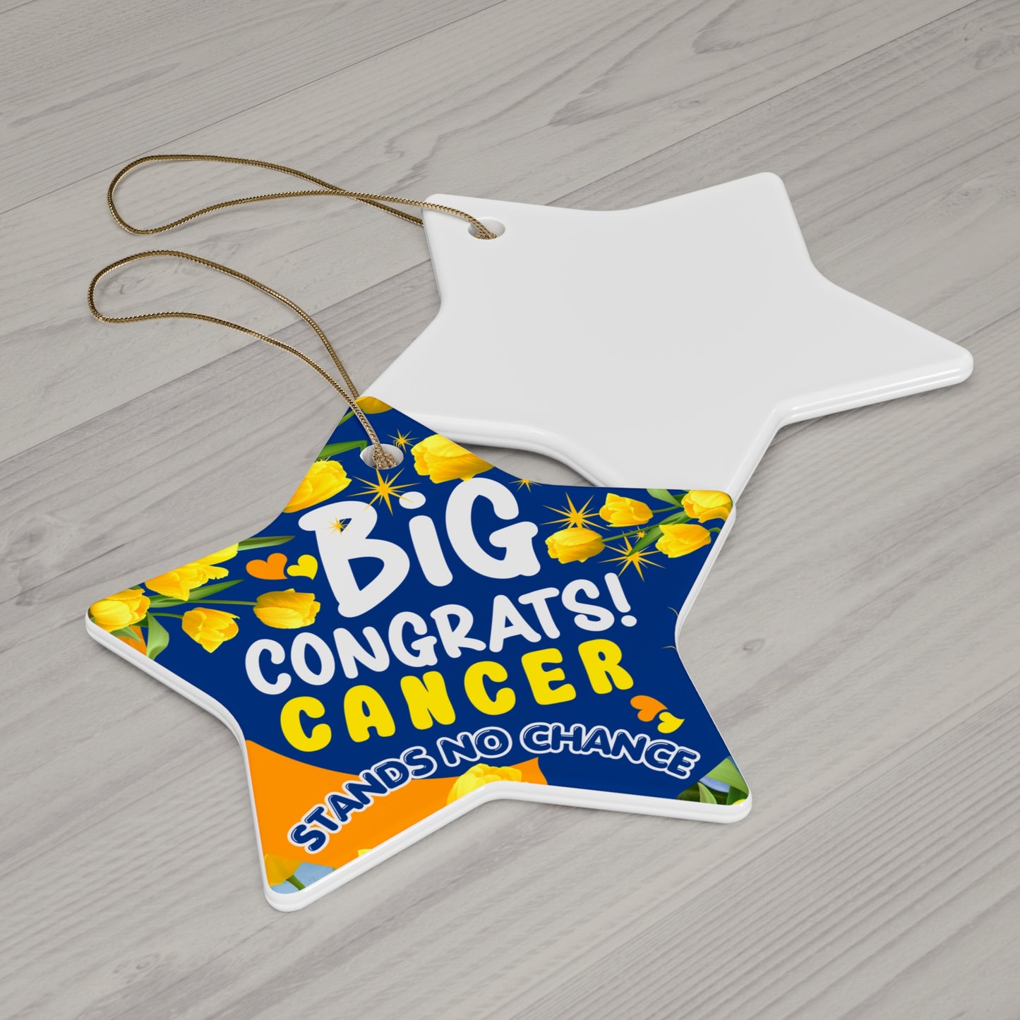 Cancer Motivational Ceramic Ornament of Victory. Star-shaped sign with 'Big Congrats! Cancer Stands No Chance' text on a wooden surface