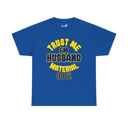 Blue t-shirt with yellow text 'TRUST ME I'M HUSBAND MATERIAL 100%' on a white background