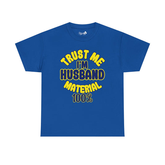 Blue t-shirt with yellow text 'TRUST ME I'M HUSBAND MATERIAL 100%' on a white background