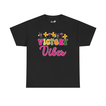 Motivational T-shirt for positive affirmations. Black t-shirt with 'Victory Vibes' text and colorful flowers on a white background