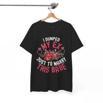 Black t-shirt with colorful text and floral design on a hanger against a white background