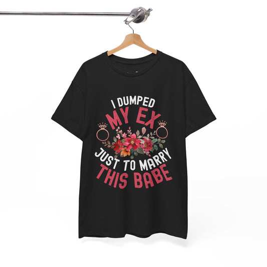Black t-shirt with colorful text and floral design on a hanger against a white background