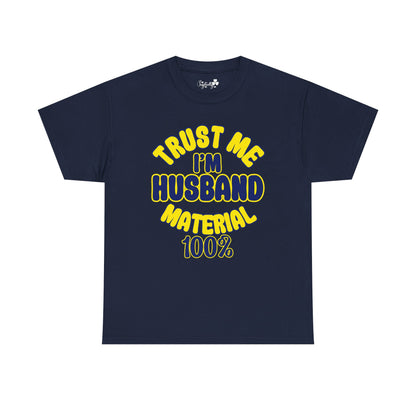 Navy blue t-shirt with yellow text 'TRUST ME I'M HUSBAND MATERIAL 100%' on a white background