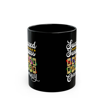 Black mug with colorful text and graphics on a white background