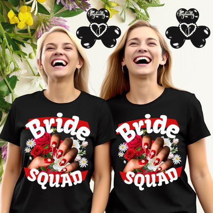 Two women wearing black 'Bride Squad' t-shirts with floral designs and text.