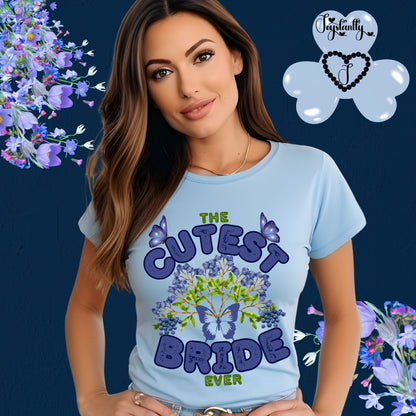 Woman wearing a light blue t-shirt with 'The Cutest Bride Ever' text and butterfly design on a floral background.