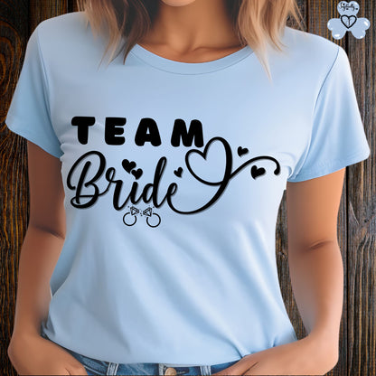 Shirt for Engagements, Bachelorettes, Hen and Bridal Parties. Light blue t-shirt with 'Team Bride' text on a wooden background