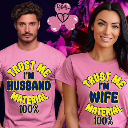 Two people wearing pink t-shirts with humorous text, surrounded by colorful graphics.