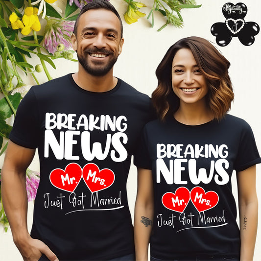 Two people wearing matching black t-shirts with 'Breaking News Mr. Mrs. Just Got Married' text and red hearts.