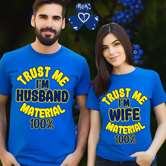 Two people wearing matching blue t-shirts with humorous text design.