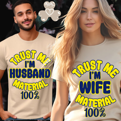 Two people wearing matching t-shirts with humorous text design.