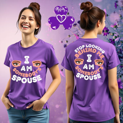 Woman wearing a purple t-shirt with text and a graphic, standing against a floral background.