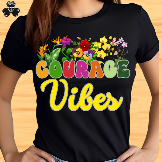 Motivational shirt. Black t-shirt with colorful 'Courage Vibes' design on a wooden surface