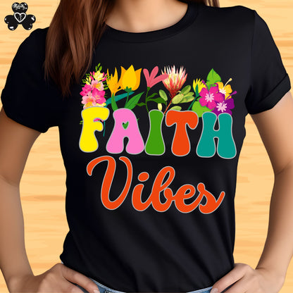 Motivational T-shirt for positive affirmations. Black t-shirt with colorful 'Faith Vibes' design on a wooden surface