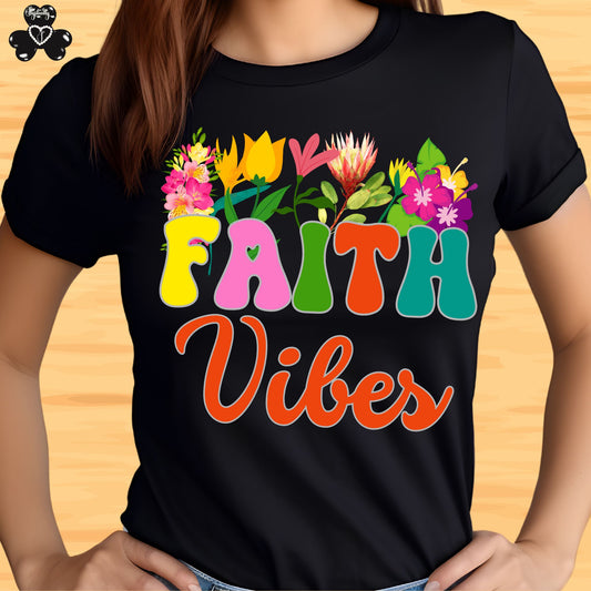 Motivational T-shirt for positive affirmations. Black t-shirt with colorful 'Faith Vibes' design on a wooden surface