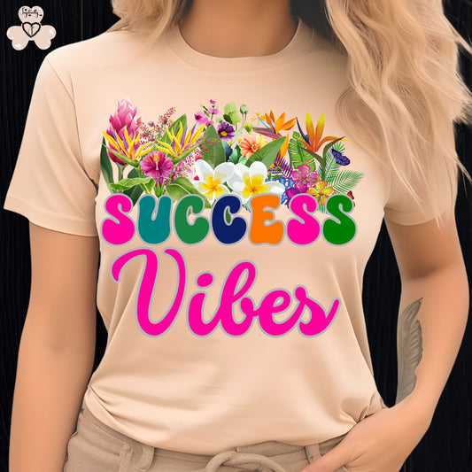 Motivational T-shirt for positive affirmations. T-shirt with colorful floral design and 'SUCCESS Vibes' text on a beige background