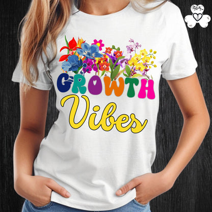 Motivational T-shirt for positive affirmations. White t-shirt with colorful floral design and 'Growth Vibes' text on a black background
